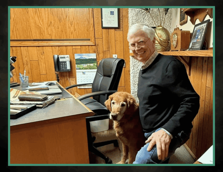 Todd Paffrath takes a moment with Drake to smile in his office here at the store.